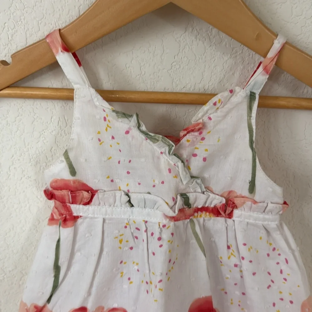 Penelope Mack • White Dress with Swiss Dots and Red & Green Floral Detailing